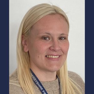 Hayley Crofts, a smiling woman with blonde hair wearing a lanyard.